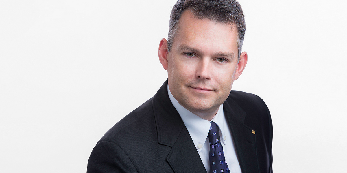 Pure white backdrop chosen for Mens Business Headshots at Company Event, executive posing skills by Brian Yungblut