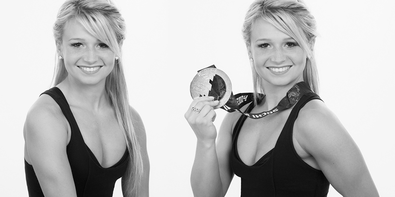 Olympic medalist poses with her silver medal at Yungblut Photography Studio in St. Catharines for black and white promotional Headshots