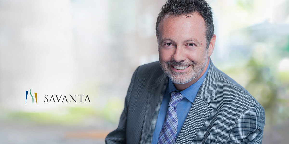 Executive Headshot for conmpany website, man in a gray suit, smiling for photographer Brian Yungblut in St. Catharines