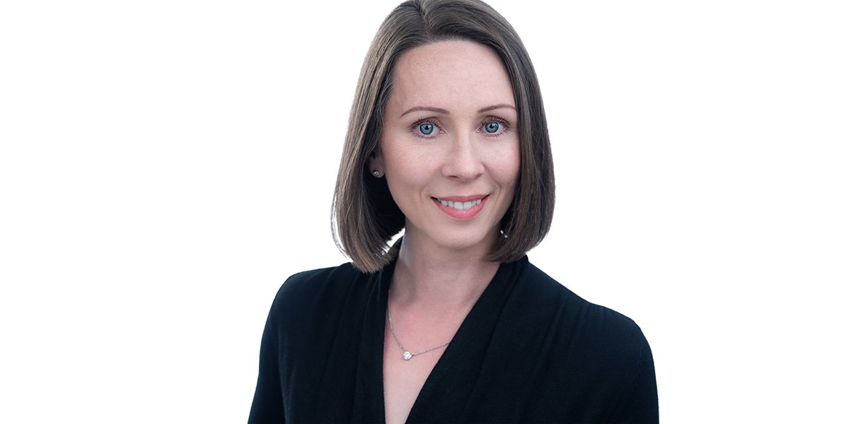 Business Woman with dark hair wearing a dark jacket, shot at Yungblut Photography in St. Catharines