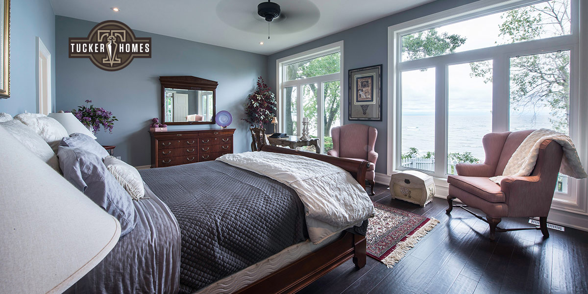 Niagara Real Estate Photographer Yungblut shoots a Bedroom where Glass Doors look out to Lake Ontario